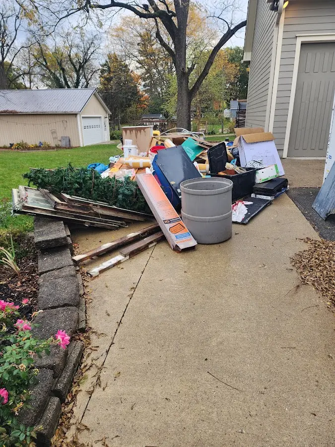 Dumpster being loaded with debris for 30 Yard Dumpster Rental in Boothbay